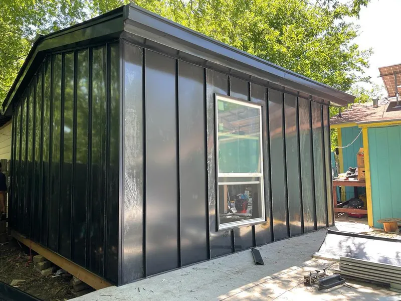 Black standing seam metal wall panels for Roof Inspection in Little Elm