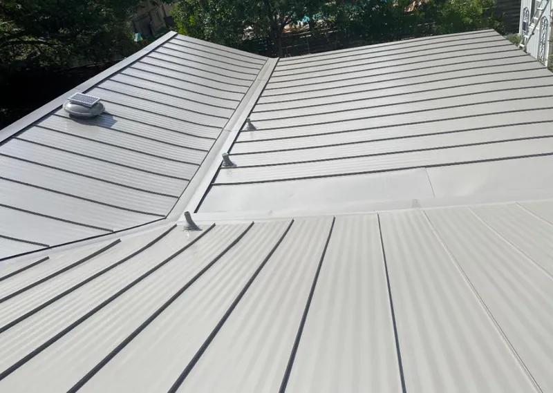 Solar attic fan installed on a metal roof for Roof Ventilation in Little Elm
